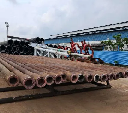 Drill pipe laid out at a pipe yard for inspection