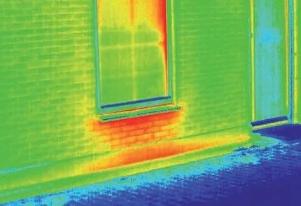 Infrared thermography image of heat loss along a wall