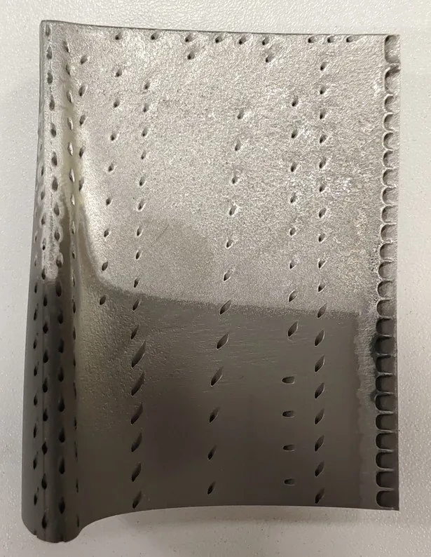 Turbine airfoil after near-net build-up and melt cycle, with cooling holes open